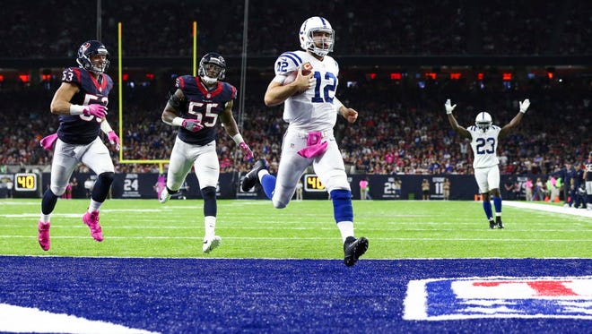 Colts quarterback Andrew Luck (12) scores a touchdown on a keeper during the fourth quarter against the Texans.