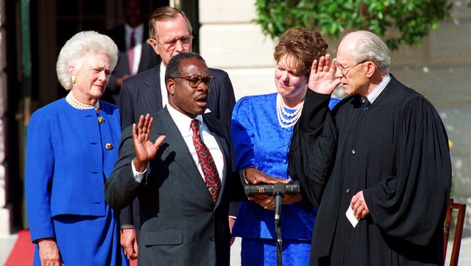 Thomas is sworn in to the Supreme Court on Oct. 18, 1991, by Justice Byron White.  Looking on, from left, are first lady Barbara Bush, President George H.W. Bush and Thomas' wife, Virginia Lamp Thomas.