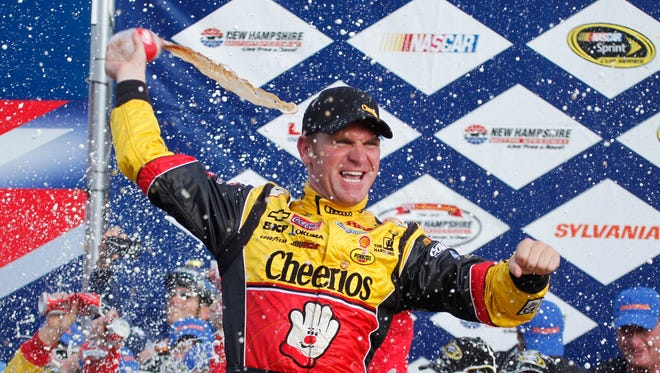 Clint Bowyer celebrates winning the Sylvania 300 at New Hampshire Motor Speedway in 2010. Bowyer also won the fall race at Talladega.