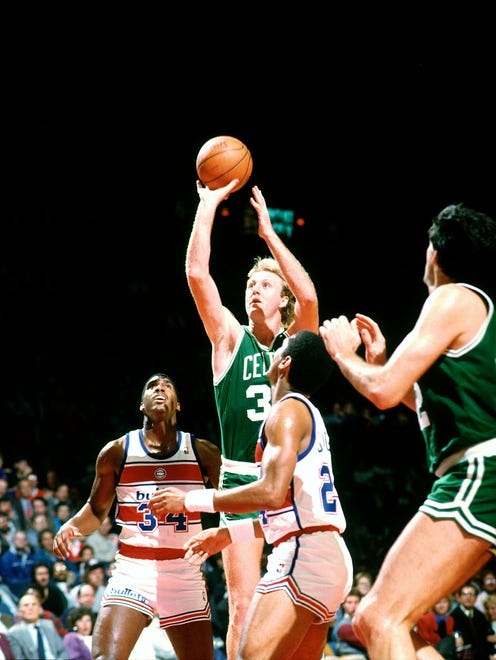 Larry Bird takes a jumper in a 1986 game against the Washington Bullets.