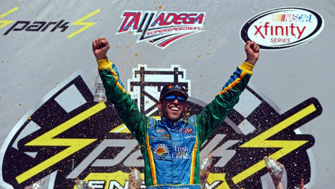 Aric Almirola celebrates after winning the Sparks Energy 300, Saturday at Talladega Superspeedway.