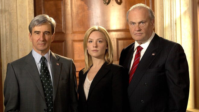 Jack McCoy (Sam Waterston) with A.D.A. Serena Southerlyn (Elisabeth Rohm) and  District Attorney Arthur Branch (Fred Thompson) of 'Law and Order.'