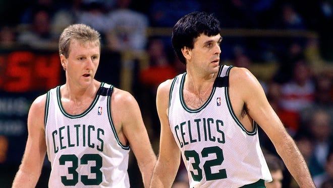 Kevin Mchale #32 and Larry Bird #33 of the Boston Celtics play defense during a game played in 1989 at the Boston Garden in Boston, Massachusetts.