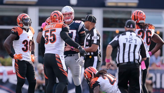 Patriots tight end Rob Gronkowski and Bengals linebacker Vontaze Burfict exchange words in the fourth quarter of Sunday's 35-17 loss by the Bengals.