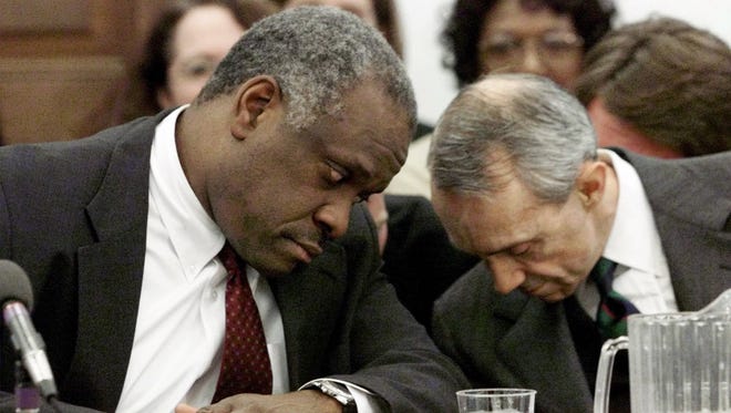 Thomas and Justice David Souter confer before the start of a House Appropriations subcommittee hearing on March 15, 2000, on Capitol Hill.