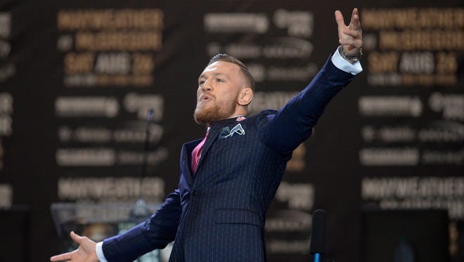 Conor McGregor reacts during a world tour press conference to promote the upcoming Mayweather vs McGregor boxing match.