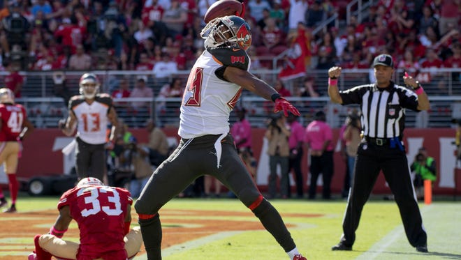 Tampa Bay Buccaneers wide receiver Russell Shepard scores a touchdown against San Francisco 49ers cornerback Rashard Robinson during the second quarter.