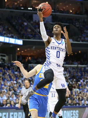 Kentucky Wildcats guard De'Aaron Fox (0) shoots against the UCLA Bruins in the first half during the semifinals of the South Regional of the 2017 NCAA Tournament at FedExForum.