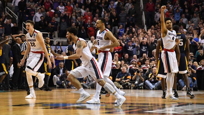 Gonzaga players celebrate after defeating West Virginia in the Sweet 16.