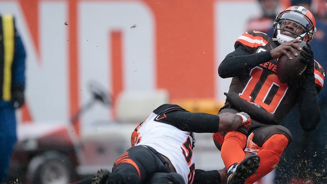 Cincinnati Bengals outside linebacker Karlos Dansby (56) tackles Cleveland Browns quarterback Robert Griffin III (10) in the first quarter during the Week 14 NFL game between the Cincinnati Bengals and the Cleveland Browns, Sunday, Dec. 11, 2016, at FirstEnergy Stadium in Cleveland. Cincinnati won 23-10.