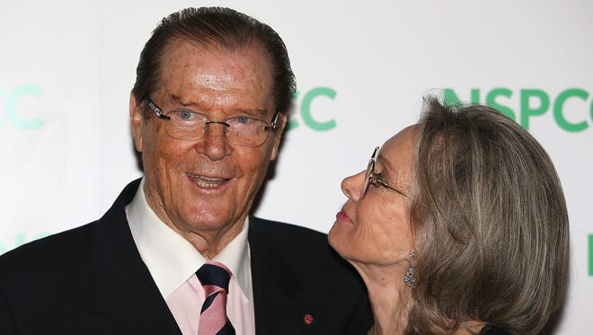 Roger Moore and his wife Kristina Tholstrup attend A Night Out With Michael Caine at Royal Albert Hall in London  Oct. 1, 2014.