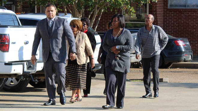 Derrick Stafford, left, walks to the Avoyelles Parish Courthouse on Wednesday, Sept. 28, 2016, with his wife, Brittany Stafford, and other family members. Stafford, a former police officer, is charged with second-degree murder and attempted second-degree murder.