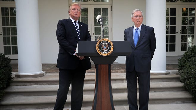 McConnell and President Trump talk to reporters in the Rose Garden following a lunch meeting at the White House on Oct. 16, 2017.