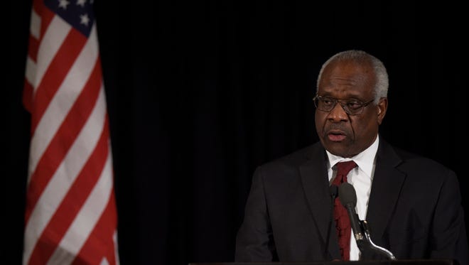 Supreme Court Justice Clarence Thomas speaks at a memorial service for the late Justice Antonin Scalia in Washington in March.