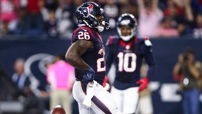 Texans running back Lamar Miller (26) scores a touchdown during the fourth quarter against the Colts.