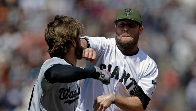 Washington Nationals' Bryce Harper, left, prepares to hit San Francisco Giants' Hunter Strickland after being hit with a pitch in the eighth inning of a baseball game Monday, May 29, 2017, in San Francisco. (AP Photo/Ben Margot) ORG XMIT: CABM111