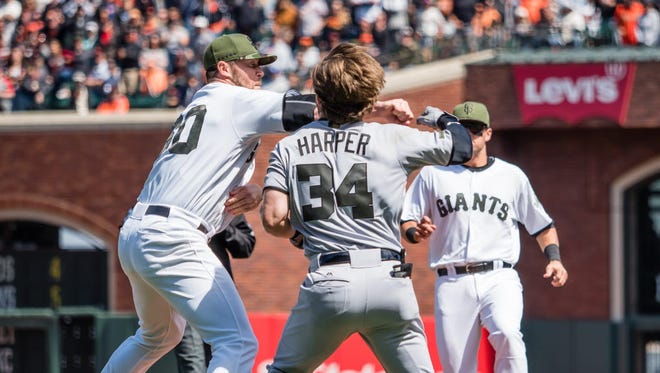 May 29, 2017; San Francisco, CA, USA; San Francisco Giants relief pitcher Hunter Strickland (60) punches Washington Nationals right fielder Bryce Harper (34) after Harper was hit by the pitch of Strickland during the eighth inning at AT&T Park. Mandatory Credit: Kelley L Cox-USA TODAY Sports ORG XMIT: USATSI-350416 ORIG FILE ID:  20170529_kek_ax5_140.JPG