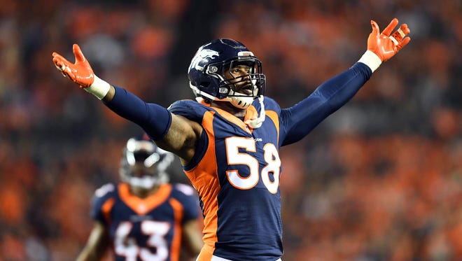 Broncos star defender Von Miller fires up the home crowd in the fourth quarter against the Texans.