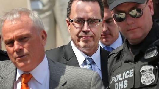 Former Subway pitchman Jared Fogle (being escorted by police after an initial court hearing in August 2015)