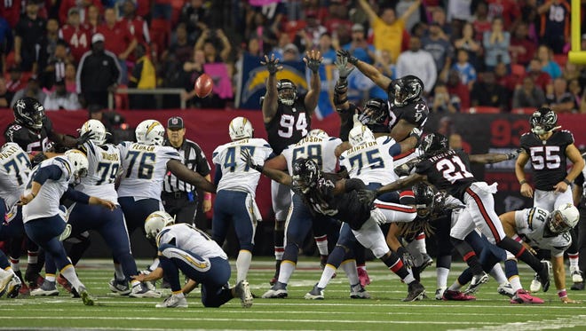 Chargers kicker Josh Lambo (2) kicks the game-winning field goal in overtime against the Falcons.