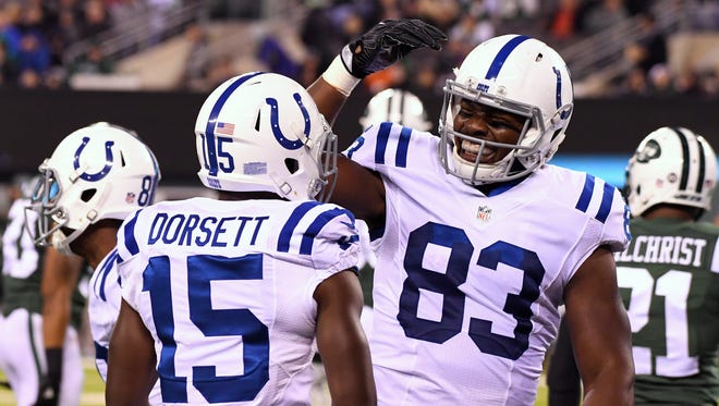 Colts tight end Dwayne Allen (83) celebrates one of his three TD catches with Phillip Dorsett (15).
