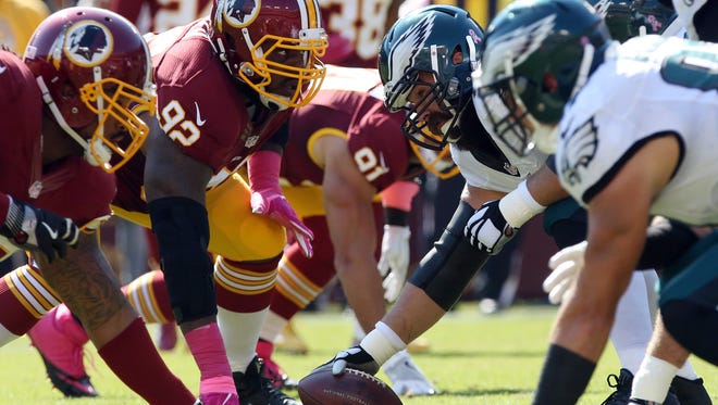 The Philadelphia Eagles offense lines up against the Washington Redskins defense in the first quarter at FedEx Field.