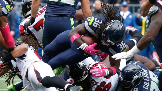 Seahawks running back Alex Collins (36) rushes for a touchdown during the second quarter against the Falcons.