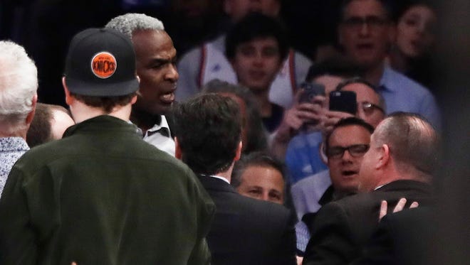 Charles Oakley is confronted by security at Madison Square Garden. The NBA Players' Association's Chris Paul and Michele Roberts spoke up on the Oakley incident on Friday.