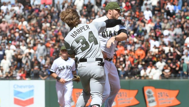 SAN FRANCISCO, CA - MAY 29:  Bryce Harper #34 of the Washington Nationals and Hunter Strickland #60 of the San Francisco Giants throw punches at one another after Strickland hit Harper with a pitch in the top of the eighth inning at AT&T Park on May 29, 2017 in San Francisco, California.  (Photo by Thearon W. Henderson/Getty Images) ORG XMIT: 700011001 ORIG FILE ID: 689831864