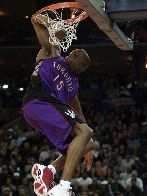2000: Vince Carter sticks his arm in the rim after dunking. This dunk would be referred to as the "Honey Dip." Carter won the competition.