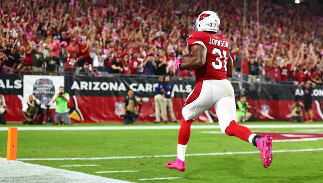 Cardinals running back David Johnson sprints into the end zone to score the first of his three TDs against the Jets.