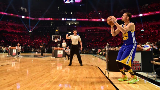 2015: Stephen Curry shoots during the 2015 NBA All-Star Three-Point Contest.