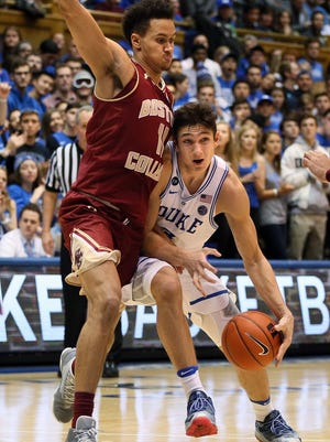 Duke Blue Devils guard Grayson Allen (3) drives against Boston College Eagles forward A.J. Turner (11) during the second half of their game at Cameron Indoor Stadium.