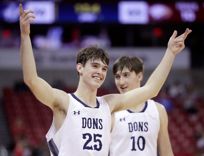 Columbus Catholic High School's Cy Becker (25) and Lucas Kreklau (10) celebrate the Dons victory over Solon Springs High School in a Division 5 semifinal game during the WIAA state boys basketball tournament on Friday, March 15, 2024 at the Kohl Center in Madison, Wis. Columbus Catholic defeated Solon 78-65.
Wm. Glasheen USA TODAY NETWORK-Wisconsin