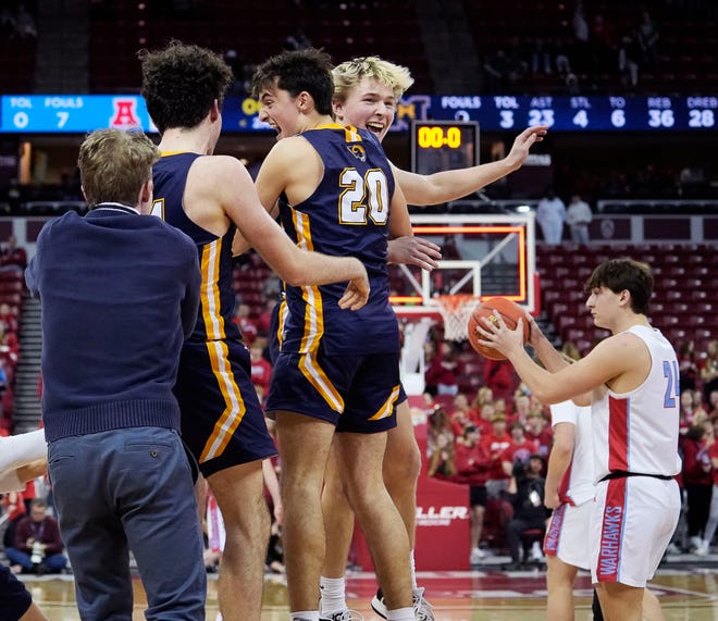 Marquette celebrates their victory over Arrowhead in the WIAA Division 1 boys basketball state championship game on Saturday March 16, 2024 at the Kohl Center in Madison, Wis.