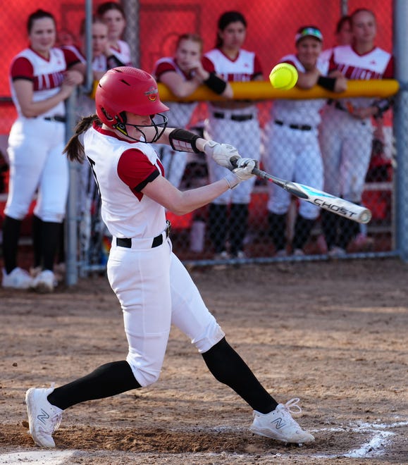 Sussex Hamilton's Lauren Bickler (5) hits a pop fly at home against Divine Savior Holy Angels on Tuesday, April 9, 2024.
