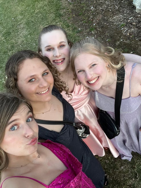 Hortonville High School sophomore Josie Hart (back) takes a selfie with her sister Abbie Hart (right), Myrinda Springer (middle) and Breanna Borel (front) before heading to prom on Saturday, April 13, 2024.