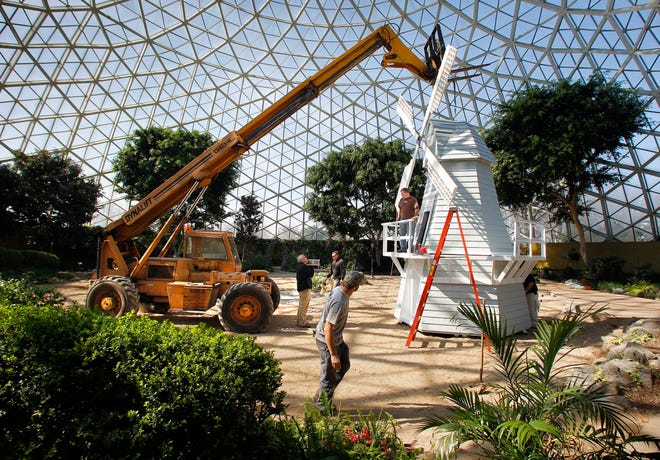Workers prepare to move a Dutch windmill in preparation for the opening of the Mitchell Park Domes show "Tulip Mania" in 2012.
