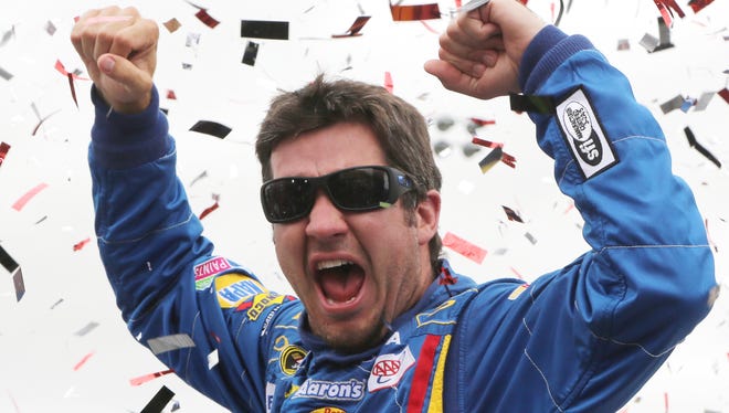 Truex Jr. celebrates in victory lane after winning the NASCAR Sprint Cup Series Toyota/Save Mart 350 at Sonoma Raceway.