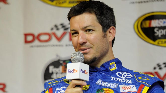 Martin Truex Jr. is interviewed during practice for the FedEx 400 Benefiting Autism Speaks at Dover International Speedway.