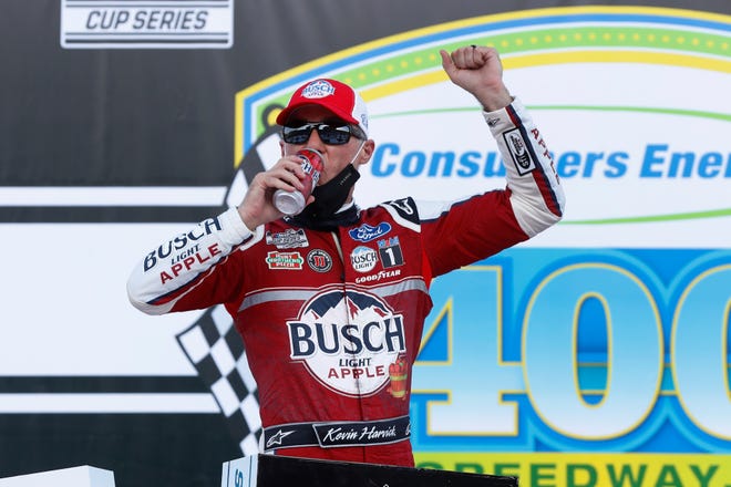 Kevin Harvick celebrates after sweeping a weekend Cup Series doubleheader at Michigan International Speedway on Aug. 9, 2020.