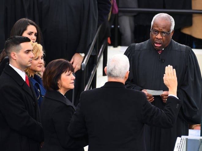Supreme Court Justice Clarence Thomas administers the oath of office to Vice President Mike Pence during the 2017 Presidential Inauguration at the U.S. Capitol on Jan. 20, 2017.